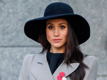 Meghan Markle attends an Anzac Day dawn service with Britain's Prince Harry, at Hyde Park Corner in London, Wednesday, April 25, 2018.