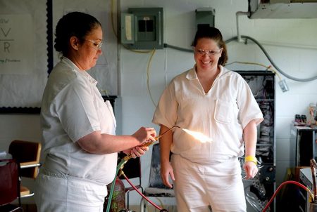 Kathleen Nicole Gillespie, left, and Amber Kenyon take an HVAC class at the Sycamore Satellite of the Crain Unit, a women's prison in Gatesville on May 15, 2018.