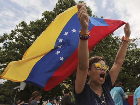 Opponents of Venezuelan President Nicolas Maduro protest the presidential election which Maduro won, in Caracas, Venezuela, on Monday.