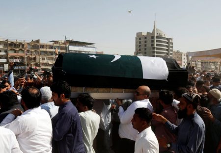 Relatives and neighbours carry the coffin, wrapped in national flag, containing the body of Sabika Aziz Sheikh, a Pakistani exchange student, who was killed with others when a gunman attacked Santa Fe High School in Santa Fe, Texas, U.S., during her funeral in Karachi, Pakistan May 23, 2018.