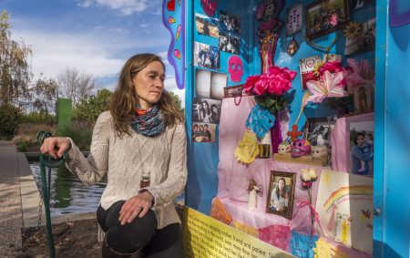 Dr. Lilia Cervantes is shown in this image as she honors her patient, Hilda, at a Día de Muertos memorial.