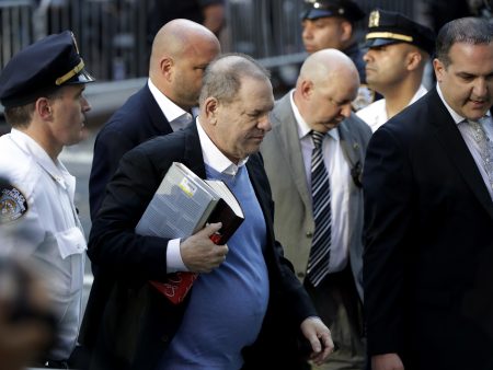 Harvey Weinstein turns himself in to police at a station in Manhattan on Friday morning.