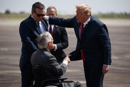 President Donald Trump talks with Sen. Ted Cruz, R-Texas, left, and Gov. Greg Abbott, R-Texas, after arriving at Ellington Field Joint Reserve Base, Thursday, May 31, 2018, in Houston.
