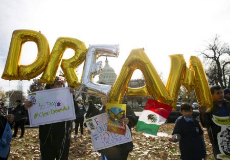 In this Dec. 6, 2017, file photo, demonstrators hold up balloons during an immigration rally in support of the Deferred Action for Childhood Arrivals (DACA)