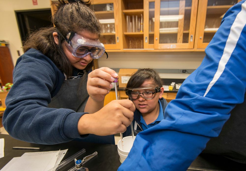 Students work on a specific heat experiment at the DeBakey High School for Health Professionals, April 12, 2017, in Houston.