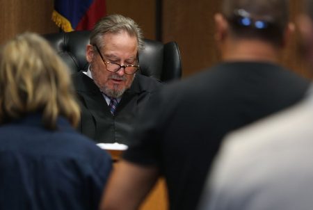 Travis County Judge Mike Denton describes the conditions — including the surrender of any guns — of a family violence protective order in his courtroom Friday, June 15, 2018.