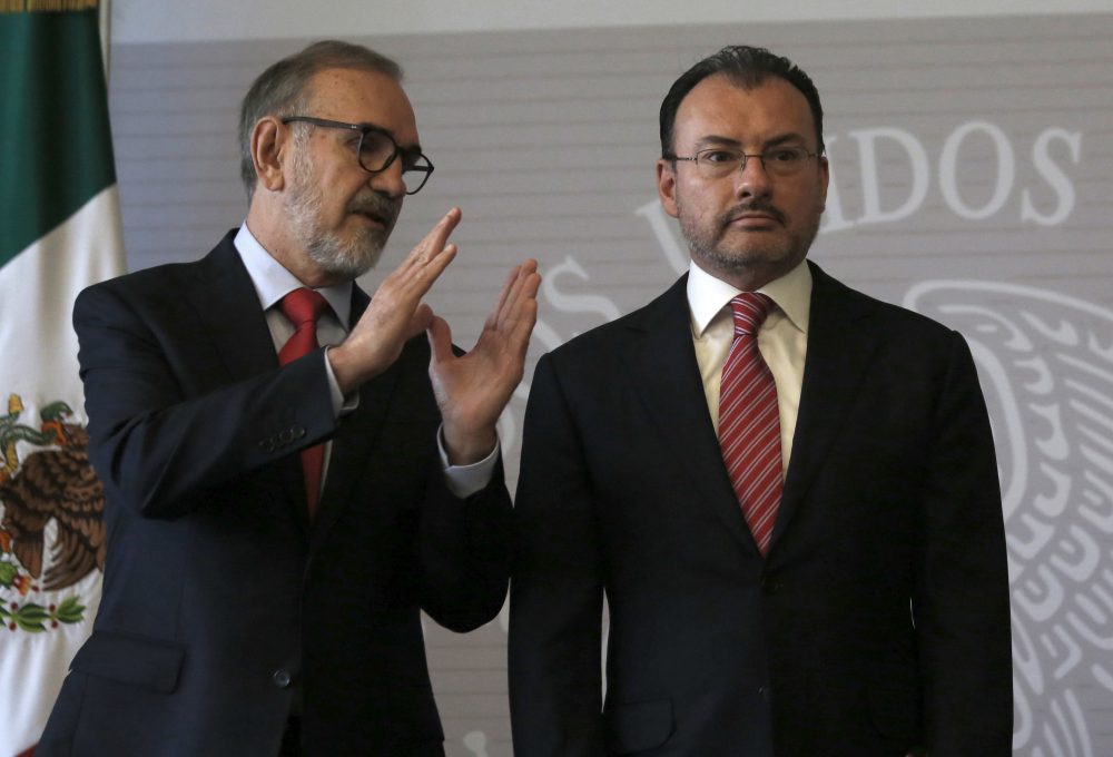 Mexican Foreign Secretary Luis Videgaray Caso, right, listens to Carlos Manuel Sada, Undersecretary for North America,  at a press conference in Mexico City, Tuesday, June 19, 2018. The Mexican government is condemning the separation of children from families on the U.S. border. Videgaray said that the country does not promote illegal migration, but it "cannot remain indifferent in the face of something that clearly represents a violation of human rights." (AP Photo/Moises Castillo)