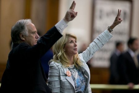 State Sens. Kirk Watson and Wendy Davis, late in the evening of Davis' filibuster five years ago, on June 25, 2013. Davis temporarily blocked a bill imposing restrictions on abortion clinics in Texas.