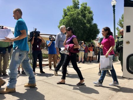 A Department of Homeland Security bus pulled up outside Annunciation House, a shelter for migrants and refugees in El Paso, Texas on Sunday. Parents filed off and walked into the shelter, some exposing their GPS ankle monitors.