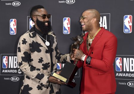 NBA player James Harden, of the Houston Rockets, left, winner of the most valuable player award, appears in the press room with his teammate P.J. Tucker at the NBA Awards on Monday, June 25, 2018, at the Barker Hangar in Santa Monica, Calif. (Photo by Richard Shotwell/Invision/AP)
