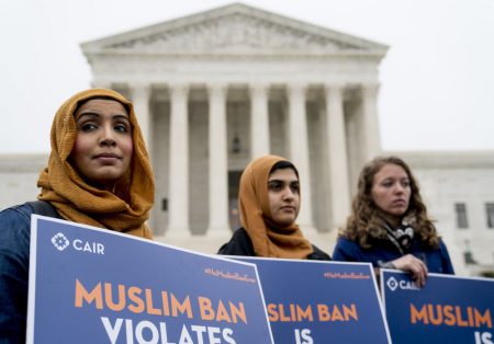 Zainab Chaudry (from left), Zainab Arain and Megan Fair with the Council on American-Islamic Relations, stand outside of the Supreme Court for an anti-Trump travel ban rally before oral arguments.