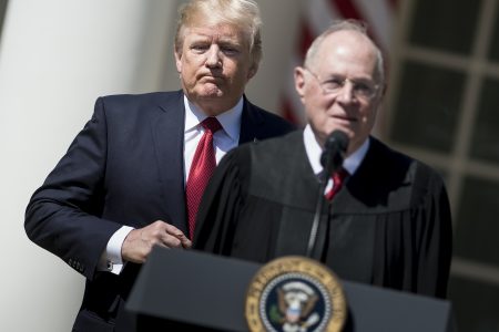 President Trump listens while Supreme Court Justice Anthony Kennedy speaks during a ceremony in the Rose Garden of the White House.