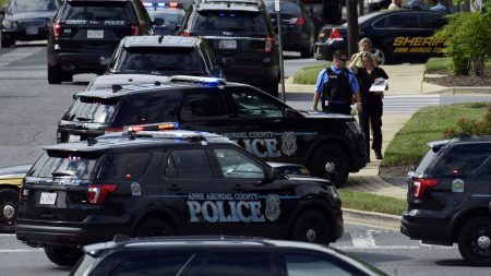 Police secure the scene of a shooting at the building housing the Capital Gazette newspaper in Annapolis, Md., Thursday. Authorities say at least five people were killed.