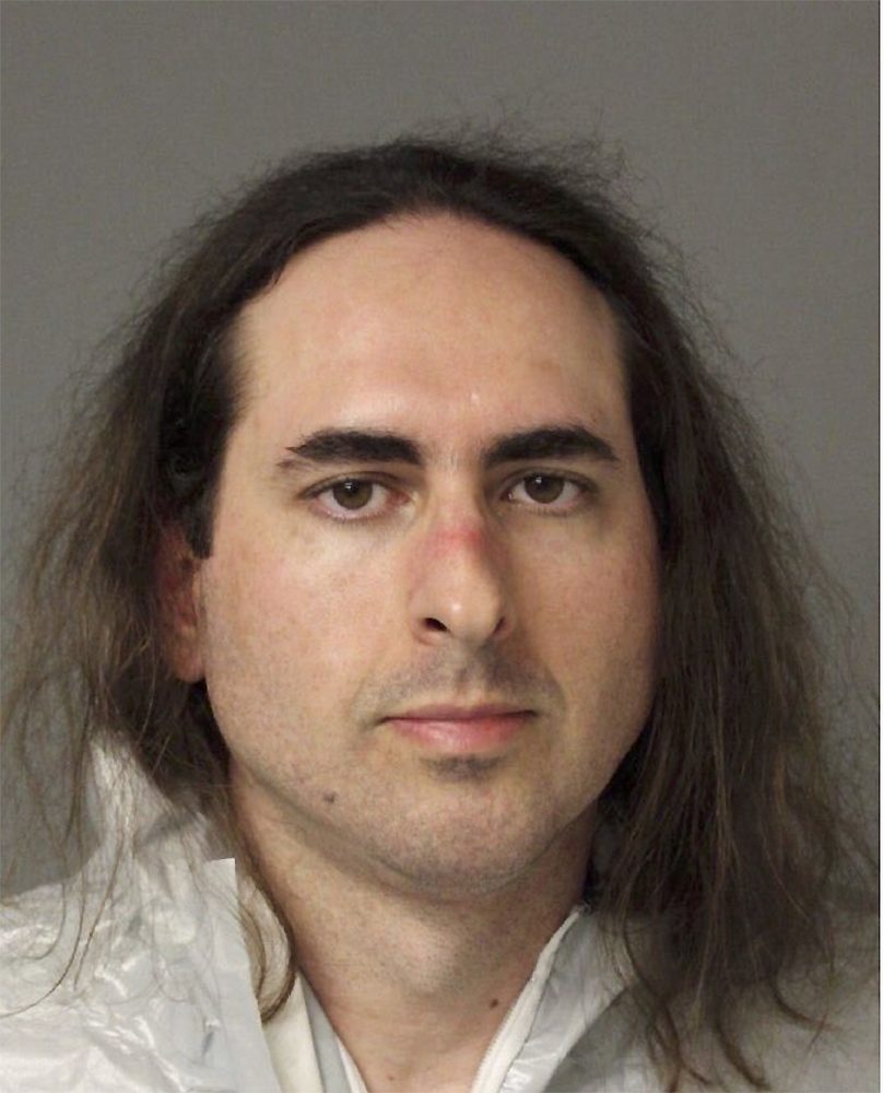 In this June 28, 2018 photo released by the Anne Arundel Police, Jarrod Warren Ramos poses for a photo, in Annapolis, Md. First-degree murder charges were filed Friday against Ramos who police said targeted Maryland's capital newspaper, shooting his way into the newsroom and killing four journalists and a staffer before officers swiftly arrested him. (Anne Arundel Police via AP)