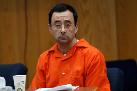 Larry Nassar, a former team USA Gymnastics doctor who pleaded guilty in November 2017 to sexual assault, listens to victims impact statements during his sentencing in the Eaton County Circuit Court in Charlotte, Michigan.