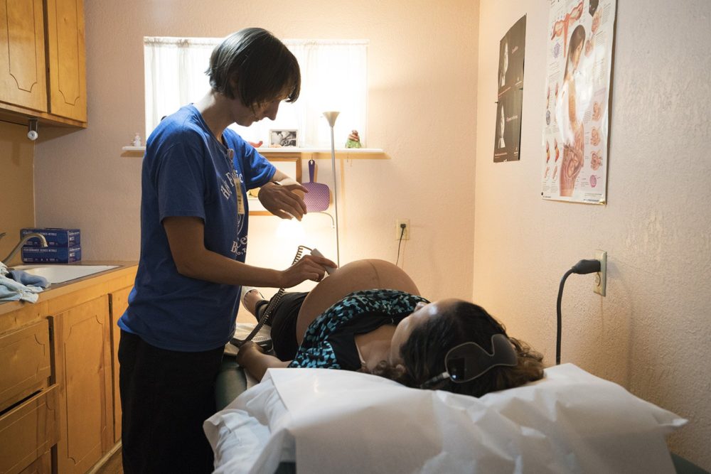 Vanna Waldron (left) evaluates Erika Piñon at the Holy Family Birthing Center in Weslaco, Texas. Waldron is a certified nurse midwife from Seattle, Washington, who is volunteering at the birthing center for a year.  Reynaldo Leal for The Texas Tribune
