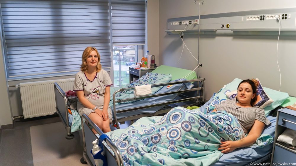 Paulina Slifierz (left) and Maja Suder (right) recover after childbirth at the Independent Public Health Care Center in Myślenice, Poland.  Natalia Ojewska for The Texas Tribune
