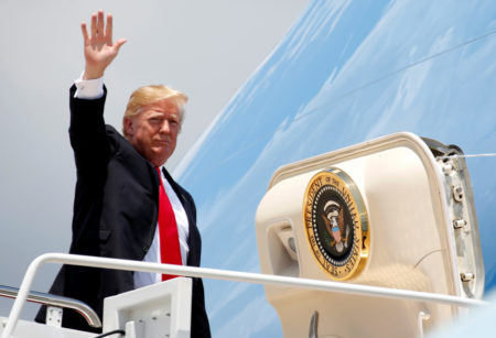 President Donald Trump waves while boarding Air Force One before departing for Great Falls, Montana at Joint Base Andrews, Maryland outside Washington, U.S., July 5, 2018.