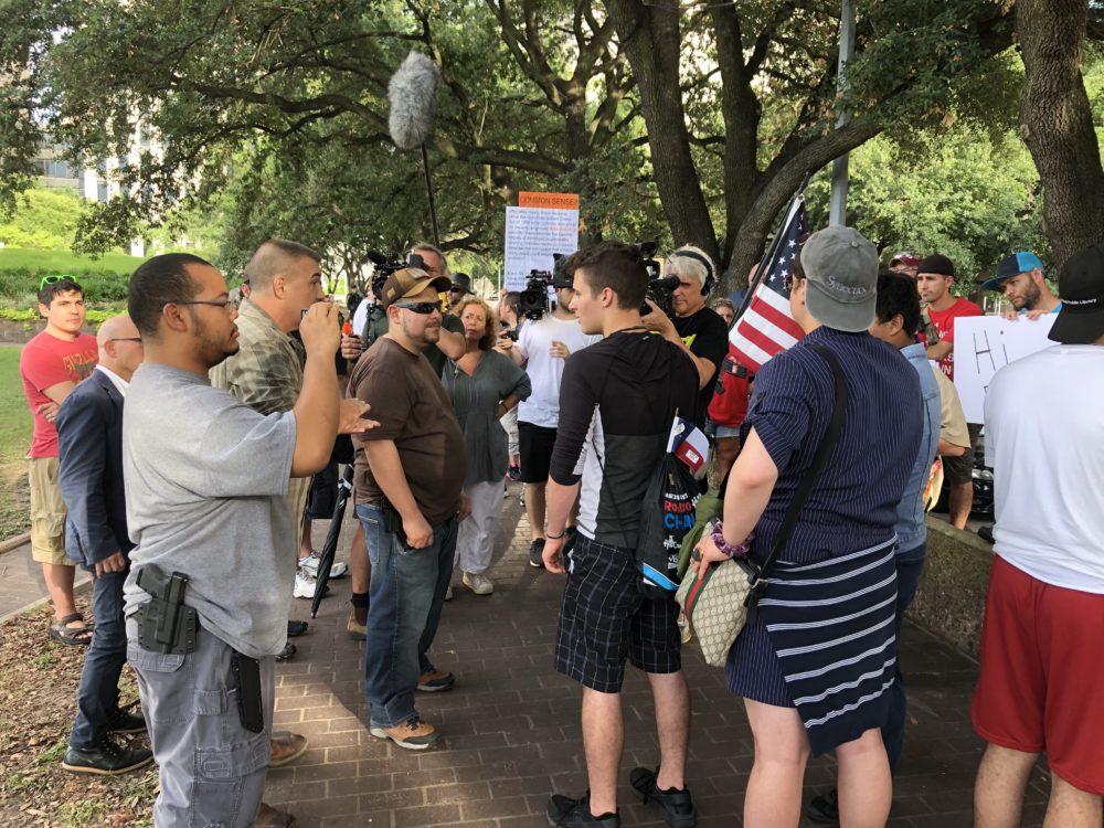 March For Our Lives activists having an open dialogue with "Open Carry Texas" activists in Houston, on July 9, 2018.