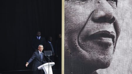 Former President Barack Obama speaks in Johannesburg on Tuesday at the centennial of Nelson Mandela's birth.