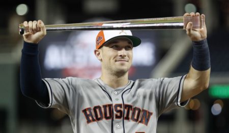 MVP Houston Astros Alex Bregman holds the trophy after the 89th MLB baseball All-Star Game, Wednesday, July 18, 2018, at Nationals Park, in Washington. The American League won 8-6.