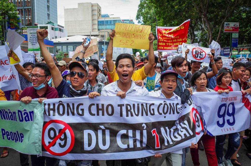 Vietnamese protesters shout slogans against a proposal to grant companies lengthy land leases during a demonstration in Ho Chi Minh City, Vietnam, June 10, 2018.