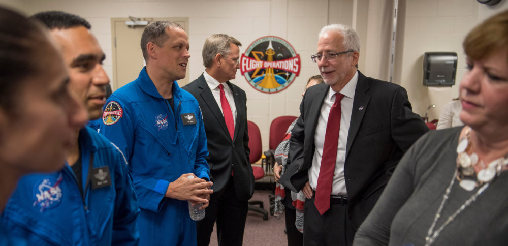 This file photo shows NASA astronaut candidate Jasmin Moghbeli, left, NASA astronaut candidate Raja Chari, NASA astronaut candidate Robert Hines, meeting with NASA Johnson Space Center Flight Operations Director Brian Kelly, Mark Geyer (second from the right) –when he was Johnson Space Center Deputy Director– and Johnson Space Center Associate Director Melanie Saunders in the green room prior to a June 2017 event where NASA introduced 12 new astronaut candidates.