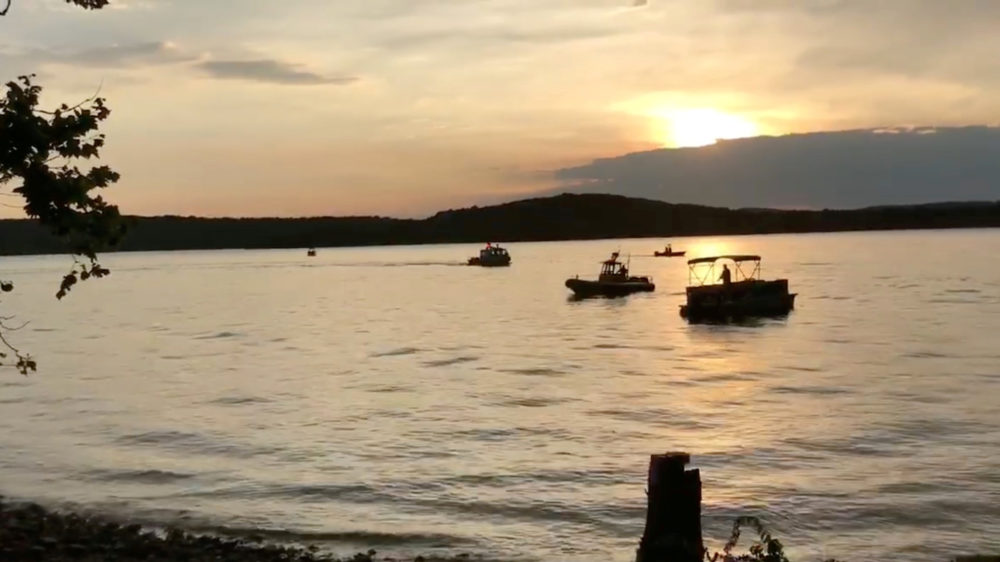 Rescue personnel work after an amphibious "duck boat" capsized and sank, at Table Rock Lake near Branson, Mo., on Thursday.
