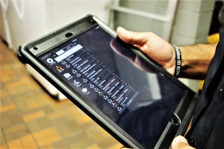 Deputy Gomez uses an iPad, as part of the county's new telepsychiatry pilot program.