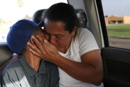 Left: Maria Marroquin Perdomo and her 11-year-old son Abisai drive away from the Casa Padre facility in the backseat of her attorney's truck minutes after mother and son were reunified in Brownsville, Texas, on July 14, 2018. Abisai was held at Casa Padre while his mother was detained at the Port Isabel detention facility.