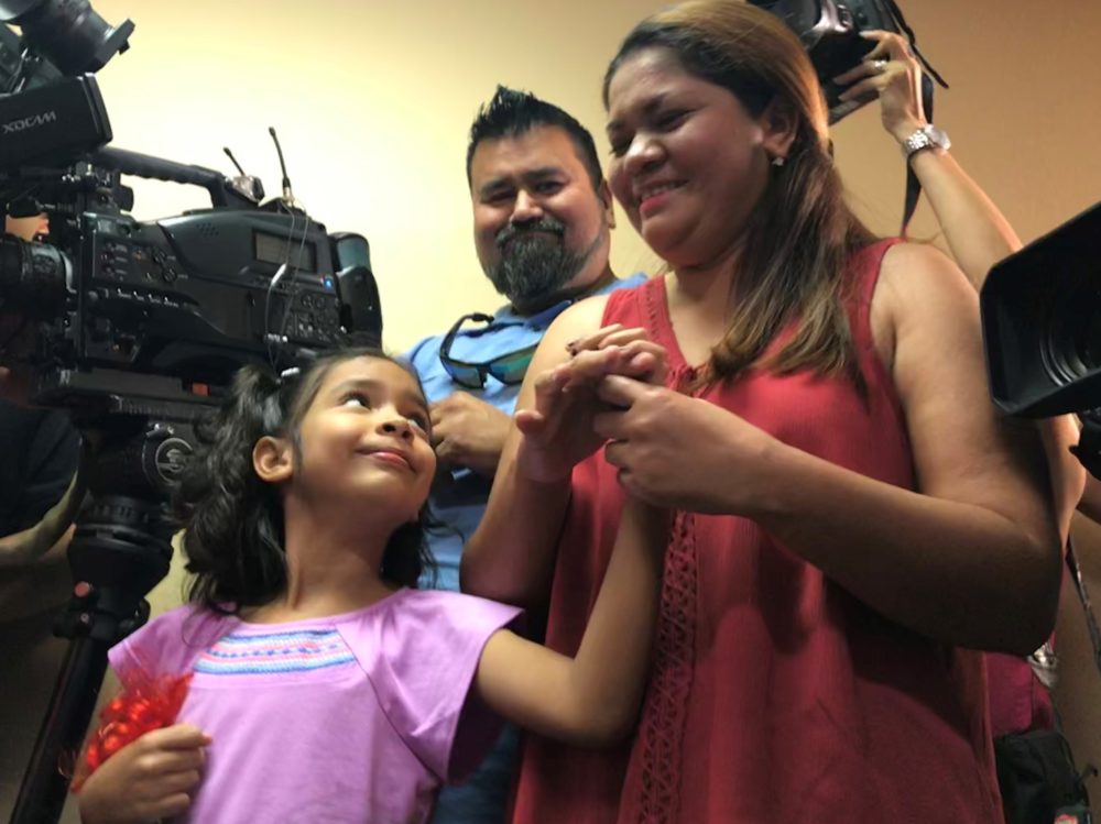 Salvadoran migrants Allison Ximena and her mother Cindy Madrid reunify in Houston. Their lawyer says they will seek asylum in the U.S.