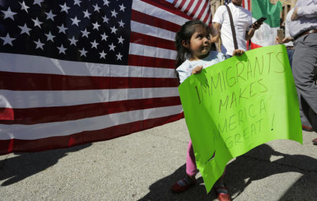 Yaretzi Perez, 4, holds a sign as she joins her family and others during an immigration protest, Thursday, Feb. 16, 2017, in Austin, Texas. Immigrants around the U.S. stayed home from work and school in a nationwide "A Day Without Immigrants" protest.