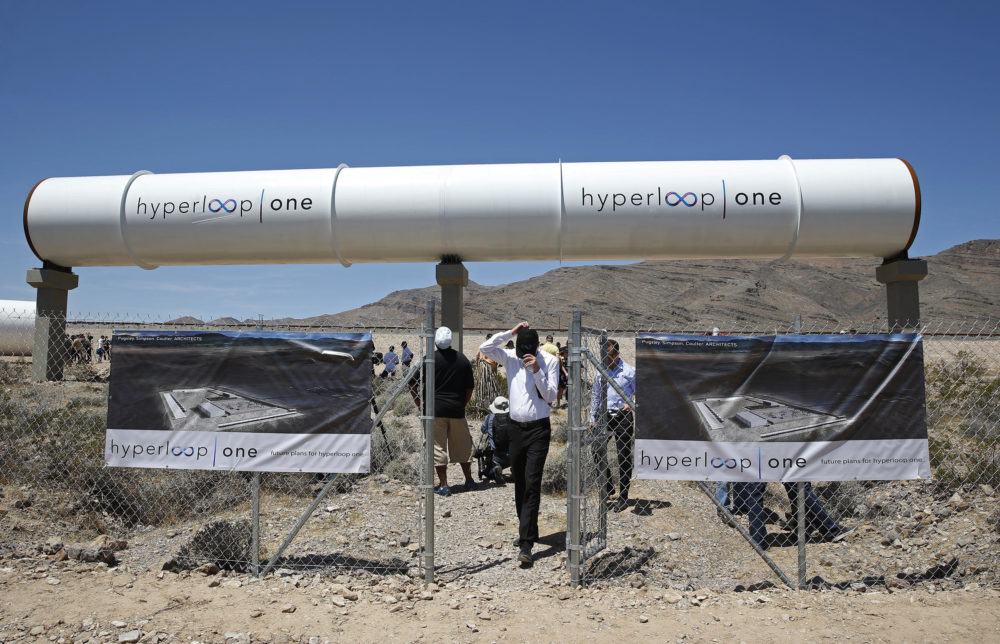 People tour the site after a test of a Hyperloop One propulsion system. The startup company opened its test site outside of Las Vegas for the first public demonstration of technology for a super-speed, tube based transportation system.
