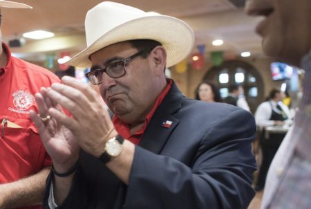 State Senate candidate Pete Flores applauds early returns showing him ahead in SD-19 race over Democrat Pete Gallego to replace Sen. Carlos Uresti, on Sept. 18, 2018.