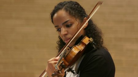 Classical musician, Anyango Yarbo-Davenport, plays the violin during the Colour of Music festival at the University of Houston in September 2018.