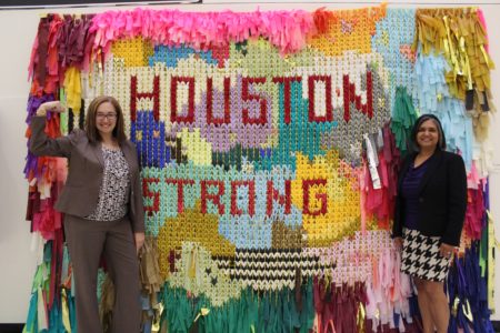 Houston Airports System employees in front of the collaborative piece by San Antonio based artists Sunny Sliger and Marianne Newsom, who donated the work to the Harvey Arts Recover Fund. This was taken during a temporary installation at George Bush Intercontinental Airport.