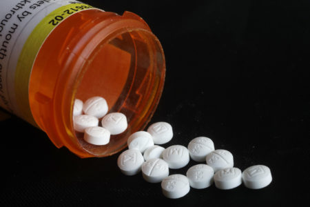 This Aug. 29, 2018 photo shows an arrangement of prescription Oxycodone pills in New York. Figures from a 2017 survey released on Friday, Sept. 14, 2018, show fewer people used heroin for the first time compared to the previous year, and fewer Americans misusing or addicted to prescription opioid painkillers. (AP Photo/Mark Lennihan)
