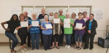 A group of seniors recently graduated from a class on managing chronic diseases, which is part of an initiative by the Harris County Public Health Department to mitigate social isolation.