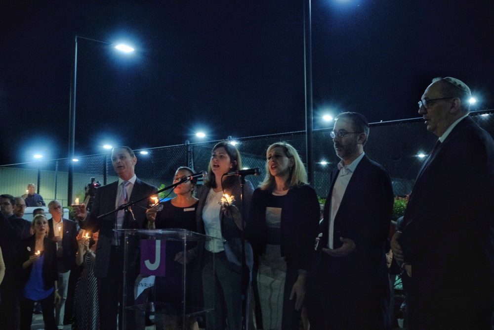 Jewish leaders and other faith-based community officials called for unity during the vigil.
