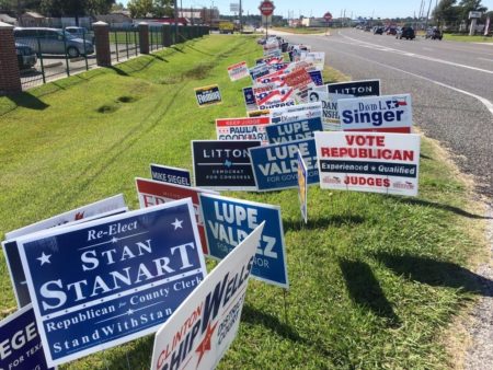 Election signs at an early voting location at Spring First Church, in Spring --a suburb north of Houston-- on October 28, 2018.
