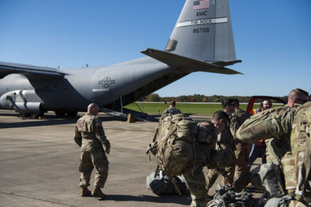This Oct. 29, 2018 photo provided by the U.S. Air Force shows deployers from Headquarters Company, 89th Military Police Brigade, Task Force Griffin get ready to board a C-130J Super Hercules from Little Rock, Arkansas, at Fort Knox, Kentucky, in support of Operation Faithful Patriot. The Trump administration on Monday, Oct. 29, 2018, announced plans to deploy 5,200 active duty troops, double the 2,000 who are in Syria fighting the Islamic State group, to the border to help stave off the caravans. The main caravan, still in southern Mexico, was continuing to melt away, from the original 7,000 to about 4,000, as a smaller group apparently hoped to join it.