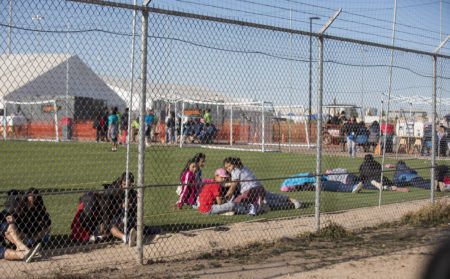 Migrant teens held inside the Tornillo detention camp sit inside the facility in Tornillo, Texas. The Trump administration announced in June 2018 that it would open the temporary shelter for up to 360 migrant children in this isolated corner of the Texas desert. Less than six months later, the facility has expanded into a detention camp holding thousands of teenagers - and it shows every sign of becoming more permanent.