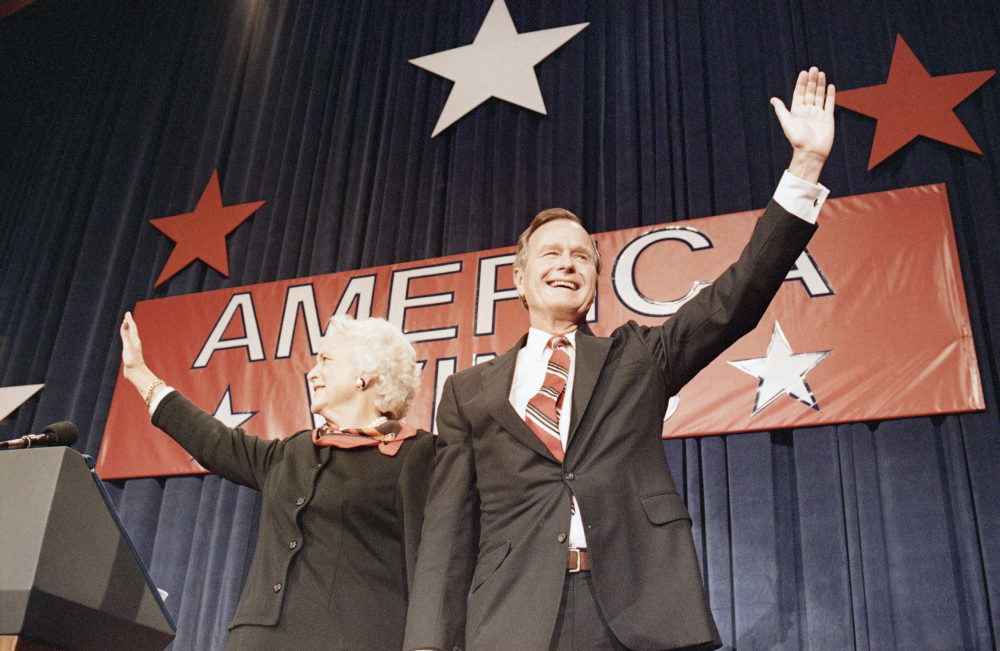 President-elect George H.W. Bush, right, and his wife Barbara, wave to the crowd at a victory celebration rally, Tuesday, Nov. 8, 1988, Houston, Tex.