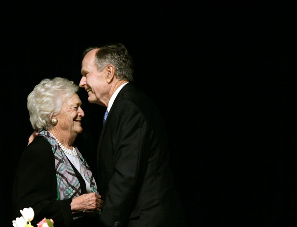In this May 3, 2006 photo, former President George H.W. Bush embraces former first lady Barbara Bush after she introduced him at the Genesis Women's Shelter Mother's Day Luncheon in Dallas. The Bushes, who have had the longest marriage of any presidential couple in American history, were both hospitalized this week in Houston, where the former president is being treated for pneumonia and his wife for bronchitis.