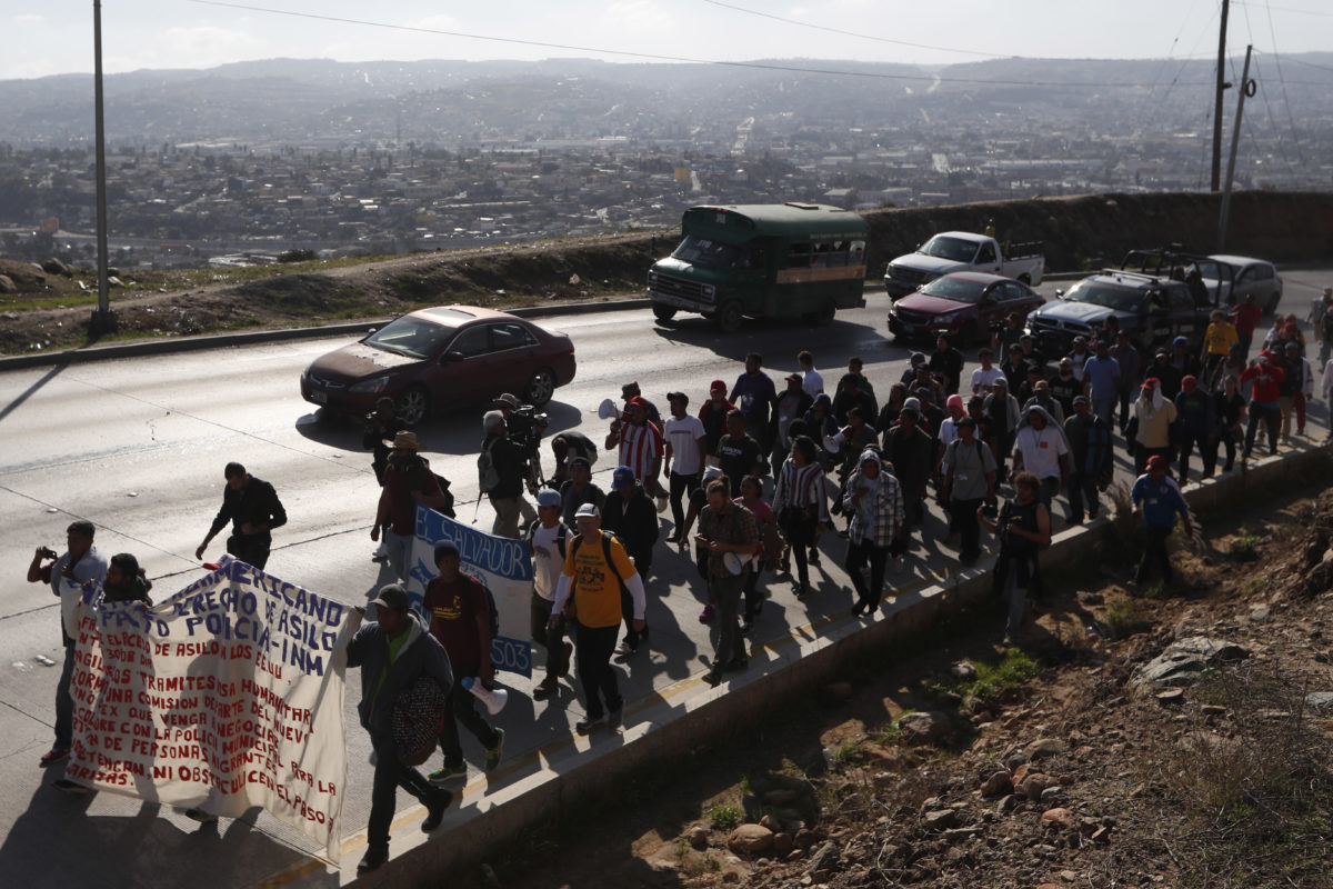 US Says Asylum-Seeking Migrants To Wait In Mexico – Houston Public Media