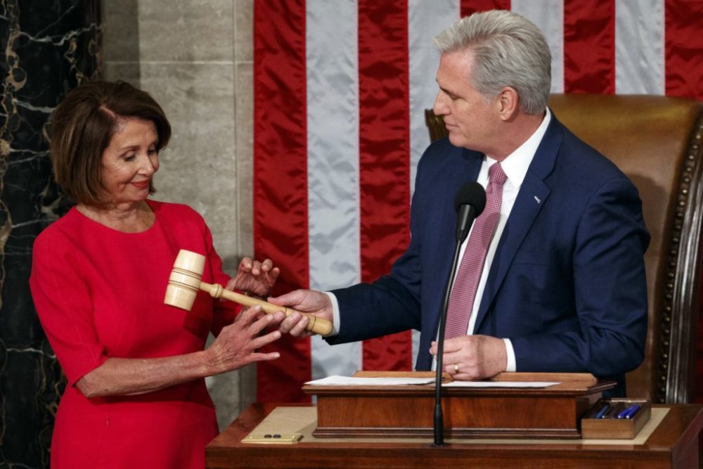 Rep. Nancy Pelosi of California takes the gavel from House Minority Leader Kevin McCarthy, R-Calif., after being elected House speaker at the Capitol in Washington on Thursday.
