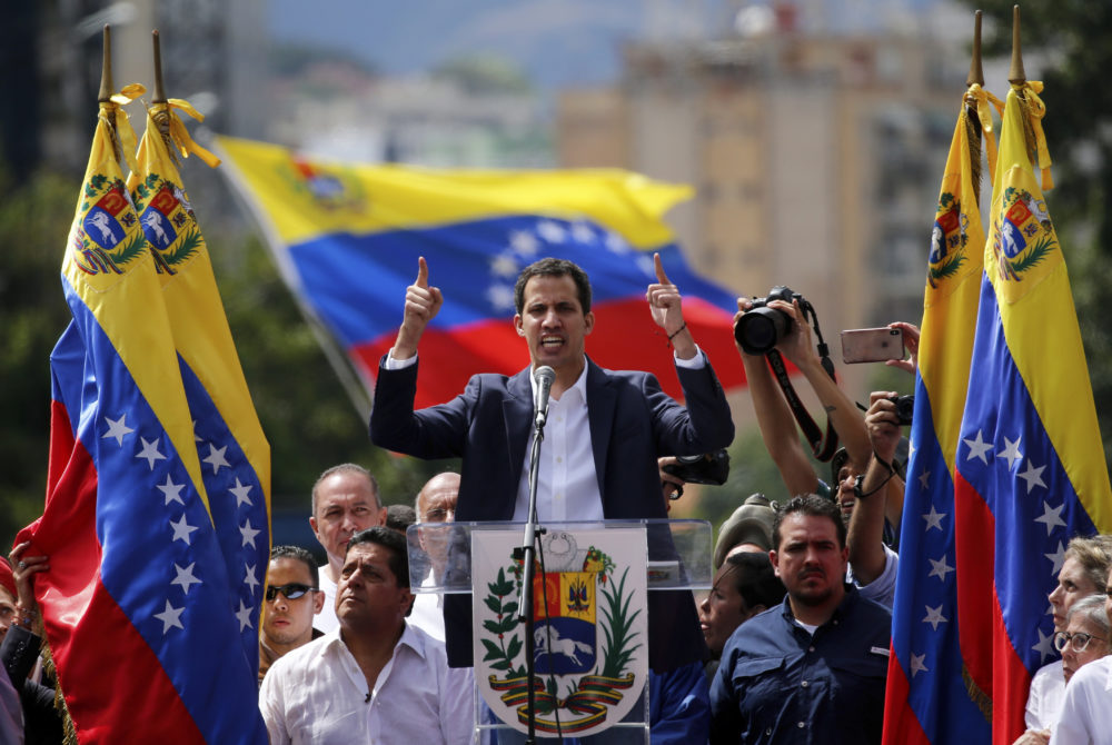 Juan Guaido, head of Venezuela's opposition-run congress, declares himself interim president of the nation until elections can be held during a rally demanding President Nicolas Maduro's resignation in Caracas, Venezuela, Wednesday, Jan. 23, 2019. 