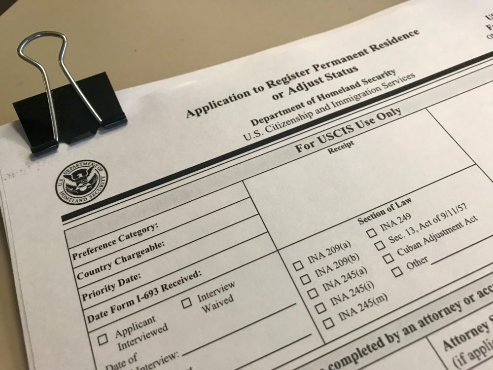 A United States Citizenship and Immigration Services form for attaining a green card, which allows immigrants to legally work. 
