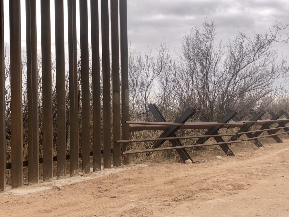 New 18-foot, steel bollard fencing is replacing an old vehicle border near the Santa Teresa Port of Entry in New Mexico. Environmentalists are concerned the new fencing will block off wildlife corridors.