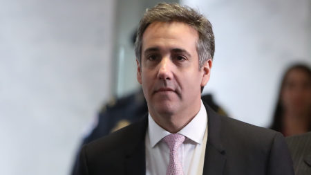 Michael Cohen, former attorney and fixer for President Trump, arrives at the Hart Senate Office Building on Tuesday before testifying to the Senate intelligence committee. Cohen testifies publicly before the House oversight committee Wednesday.